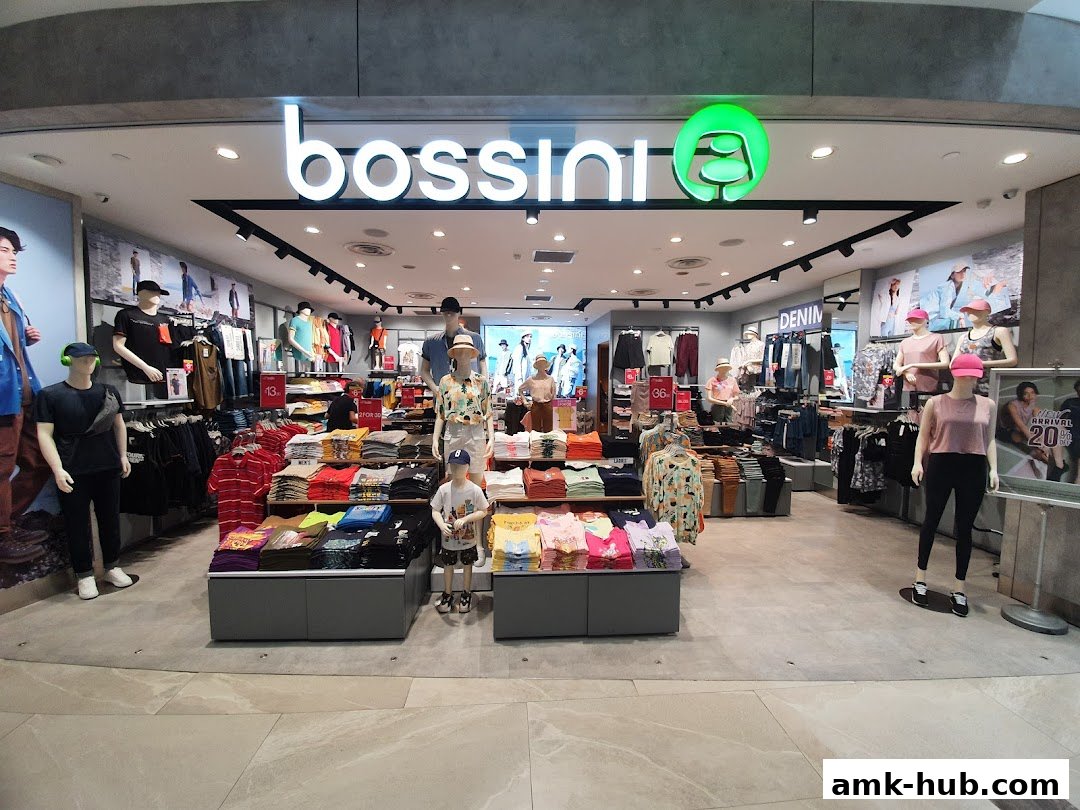 Interior view of a Bossini clothing store showcasing various apparel on mannequins and display racks.