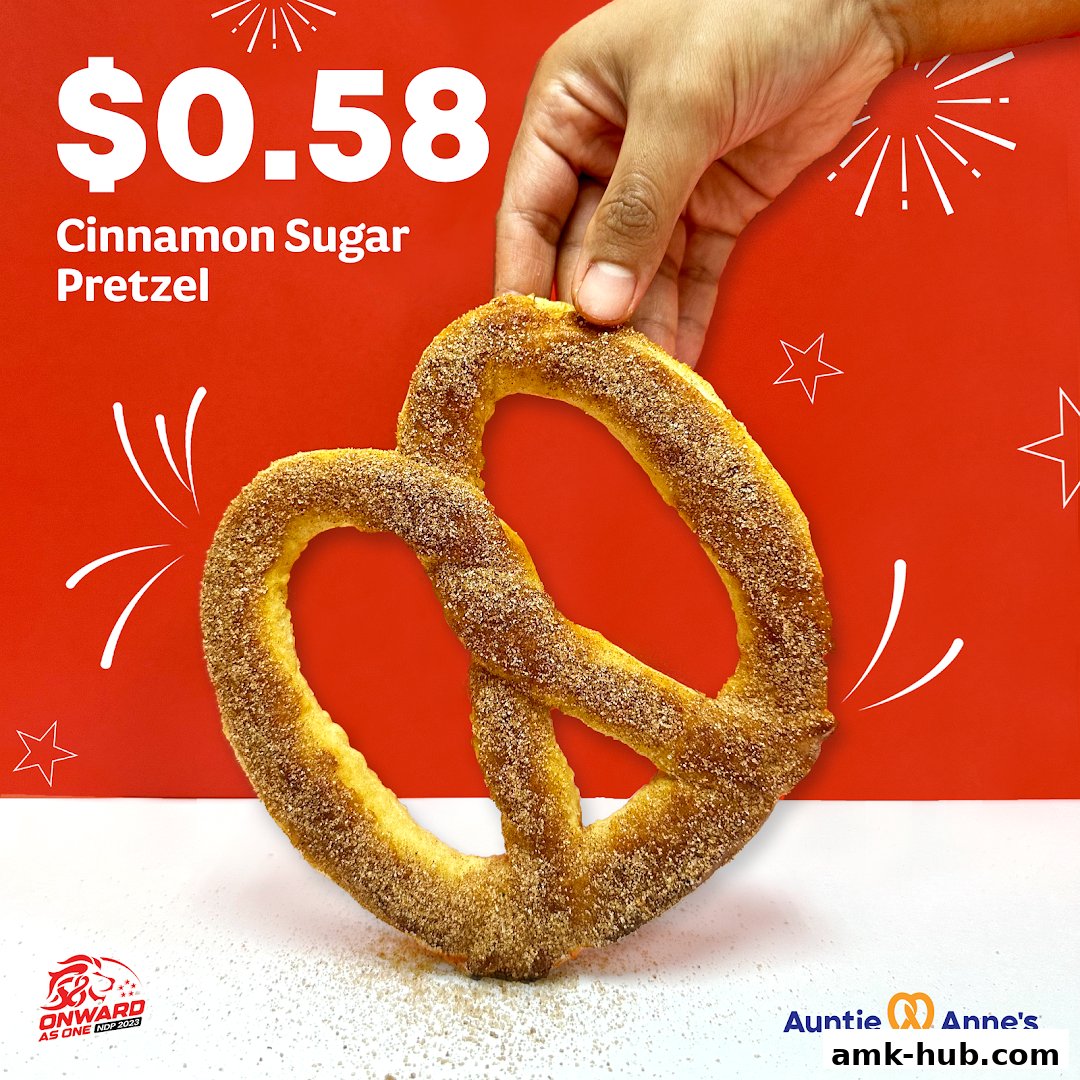 A hand holds a cinnamon sugar pretzel with a price of $0.58.