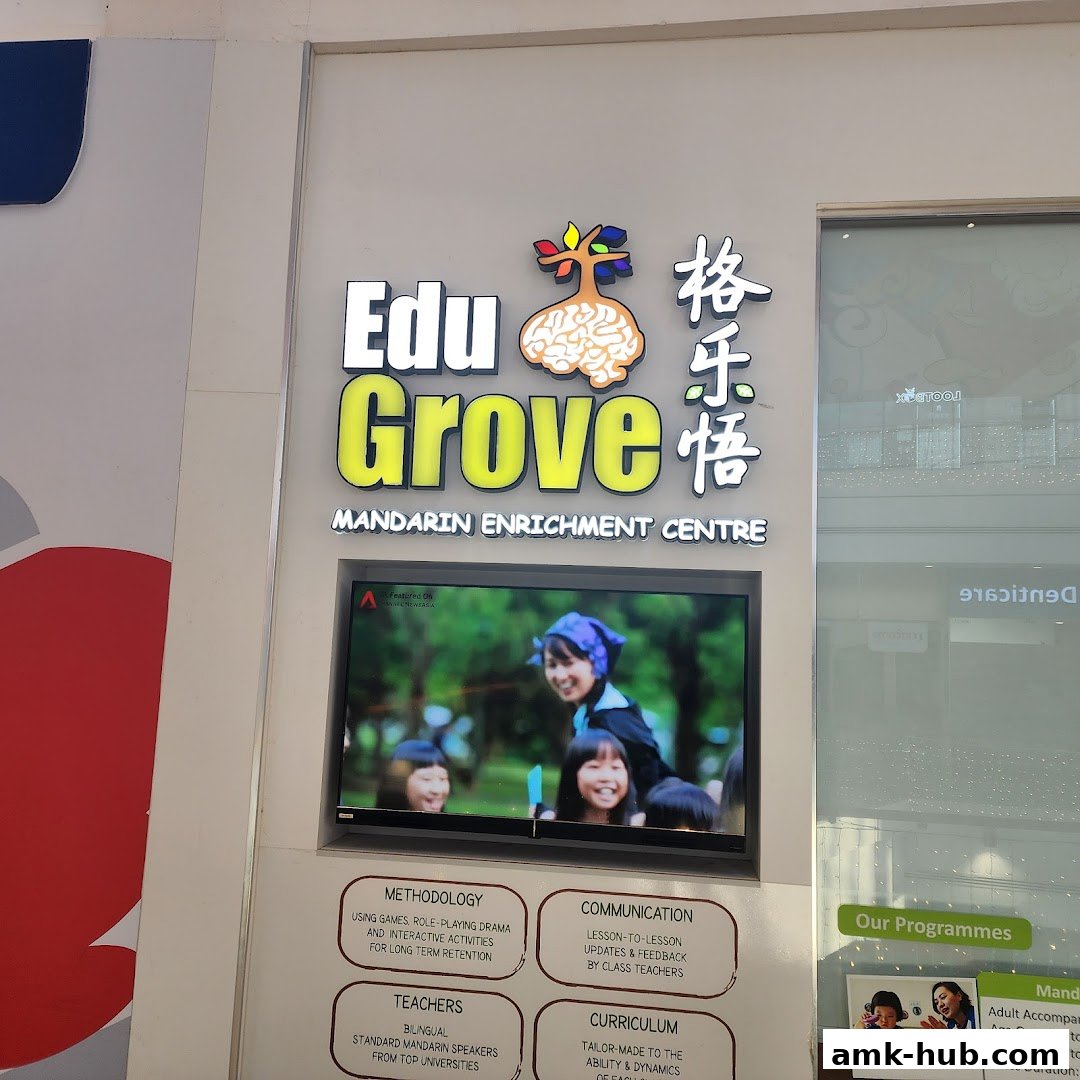 The storefront of EduGrove Mandarin Enrichment Centre, featuring its logo and information panels.