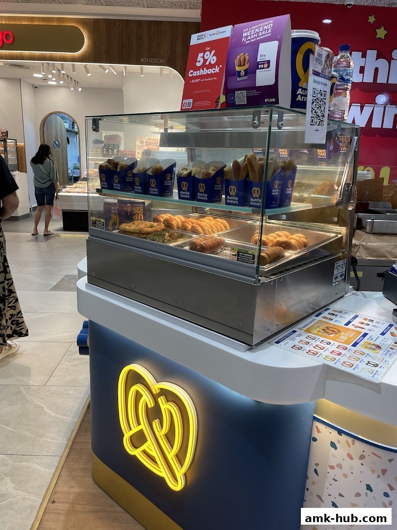 Auntie Anne's pretzel display with various pretzel options and promotional signage.