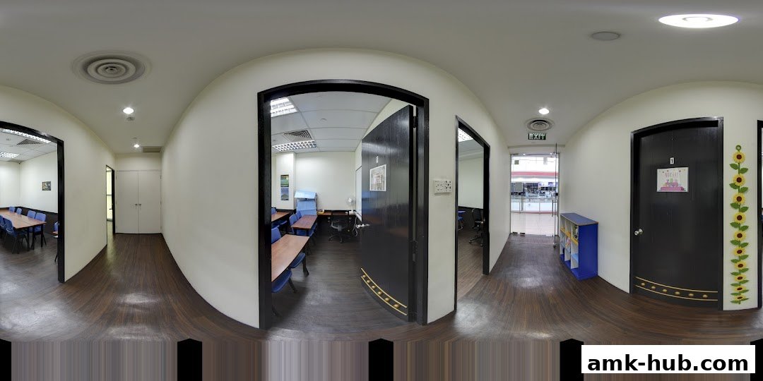 Interior view of a learning center with classrooms, desks, and chairs.