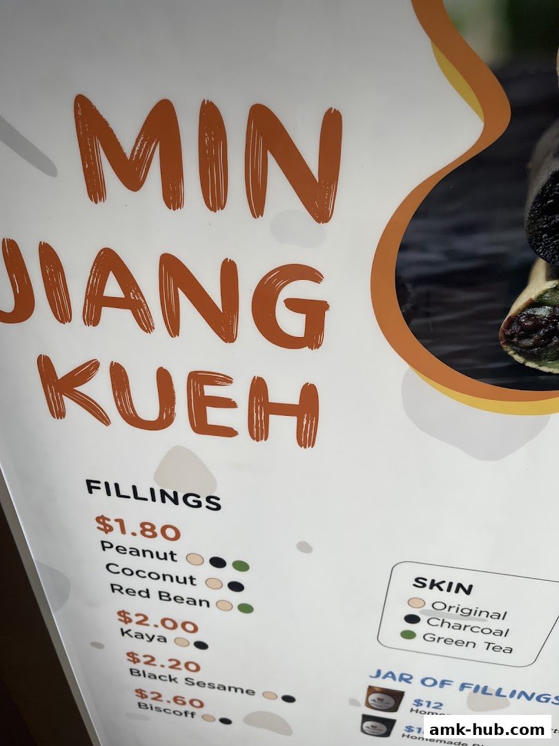 A menu board for Munchi Pancakes, showcasing fillings and skin options for their Min Jiang Kueh.