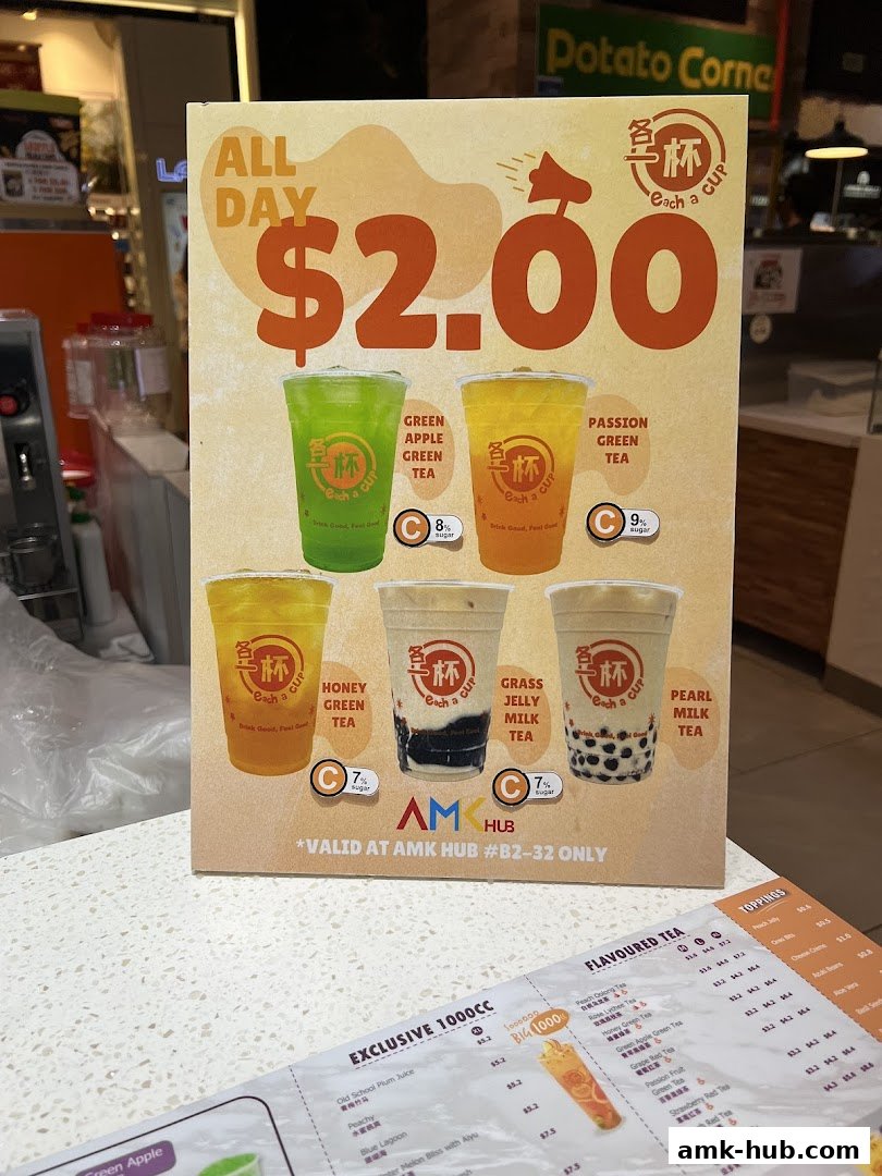 A menu board from Each A Cup featuring drinks and prices, with a special $2.00 offer.