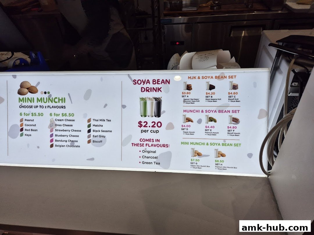 A menu board for Munchi Pancakes, featuring mini munchi flavors, drinks, and sets.