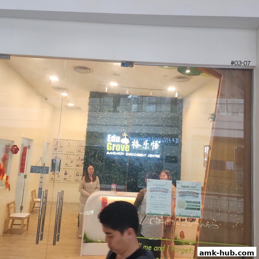 The entrance of EduGrove Mandarin Enrichment Centre with staff and signage.