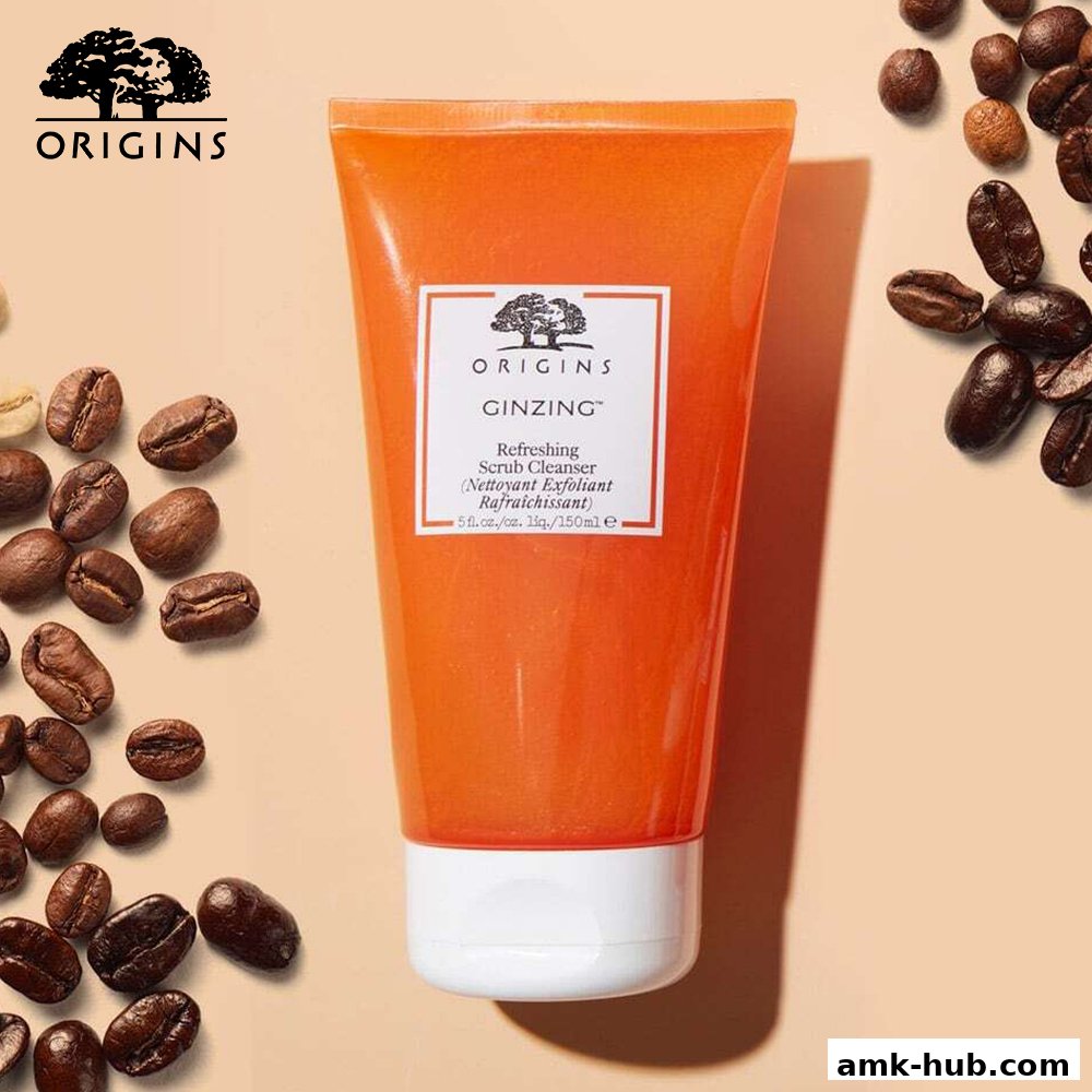 A tube of Origins GinZing Refreshing Scrub Cleanser with coffee beans.