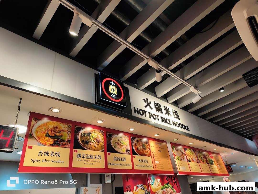 A food stall menu featuring various rice noodle dishes with appetizing images.