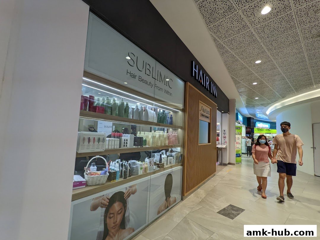 The Hair Inn shop front displays shelves stocked with hair care products and a promotional image.