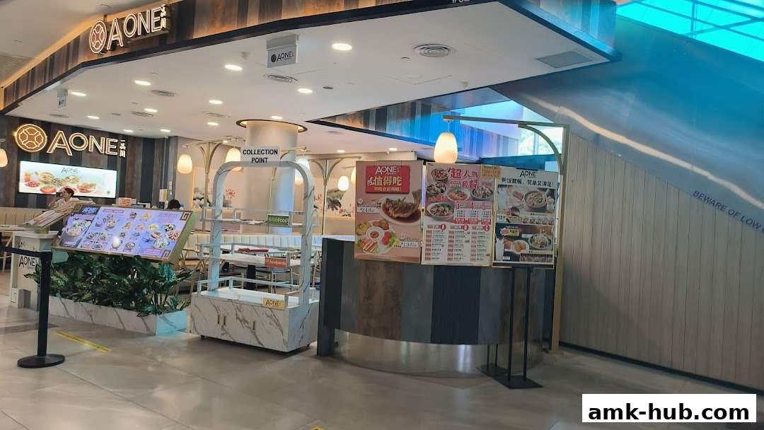 The entrance and dining area of A-One Signature restaurant with menus displayed.