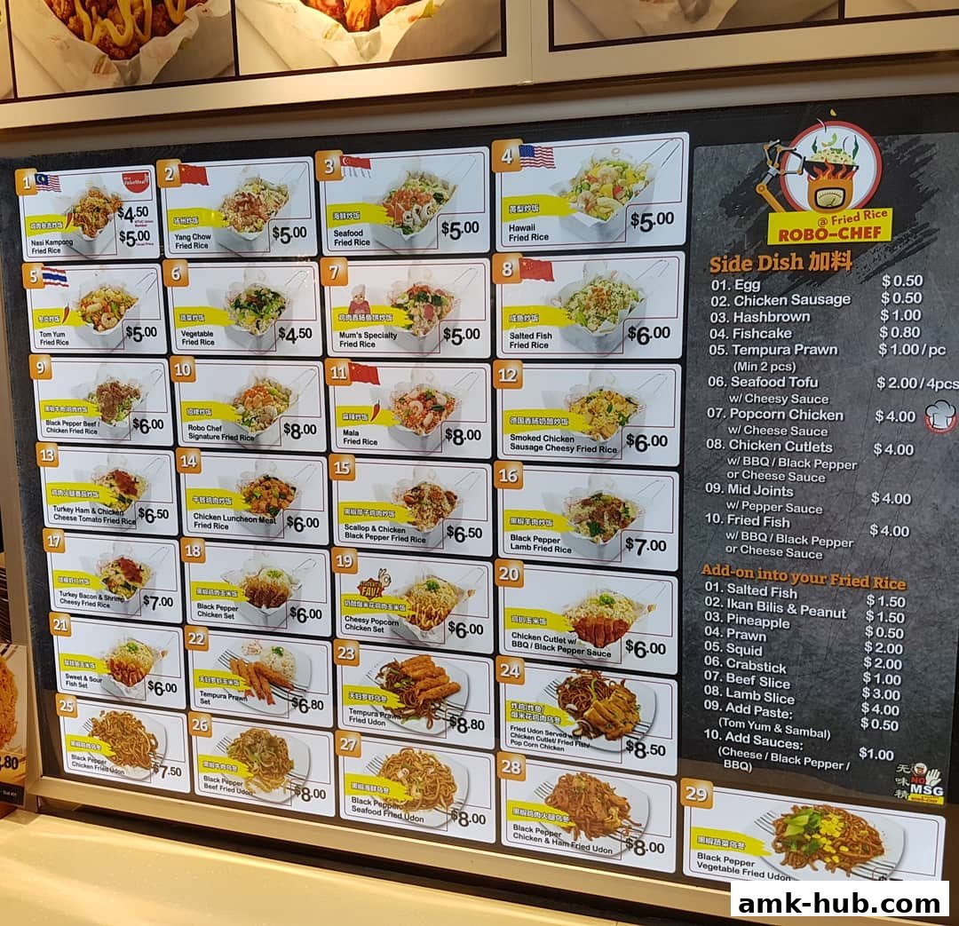 A menu board displaying various fried rice dishes, side dishes, and udon options with prices.
