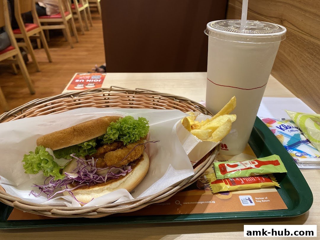 A delicious MOS Burger meal with fries and a drink on a tray.