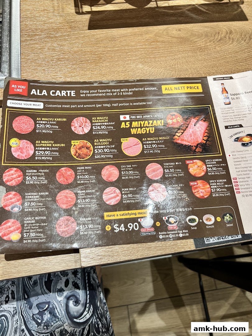 A menu for Yakiniku Like AMK Hub featuring various cuts of Wagyu beef and other meats.