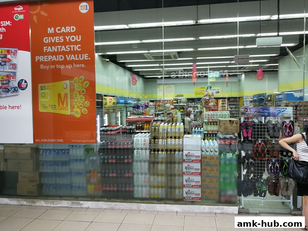 The exterior of a Cheers convenience store with promotional signage and merchandise visible through the glass.
