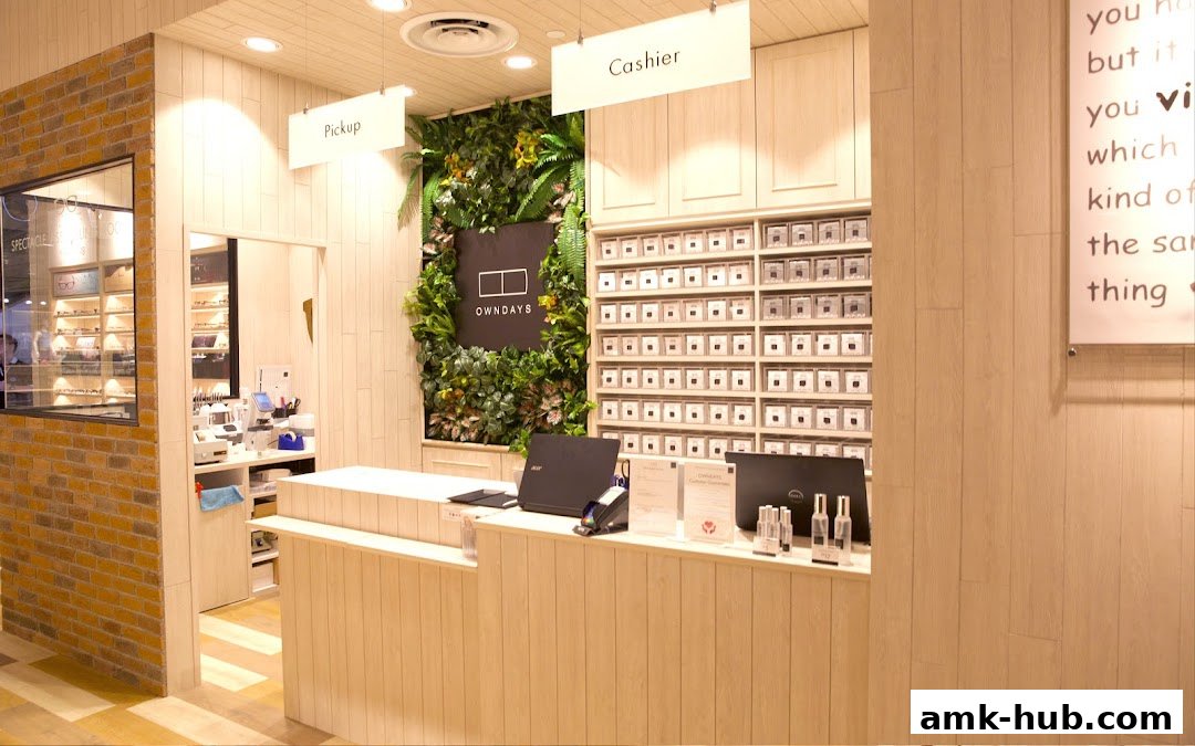 The interior of an optical shop with a cashier counter, pickup area, and displays.