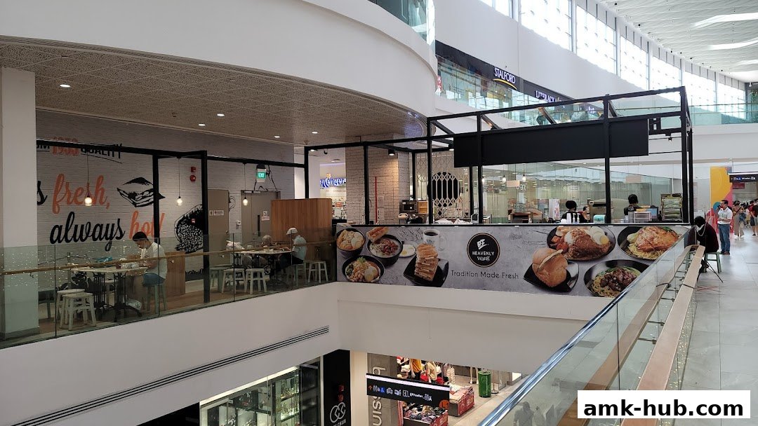 A view of the Heavenly Wang restaurant with customers dining and food displays.