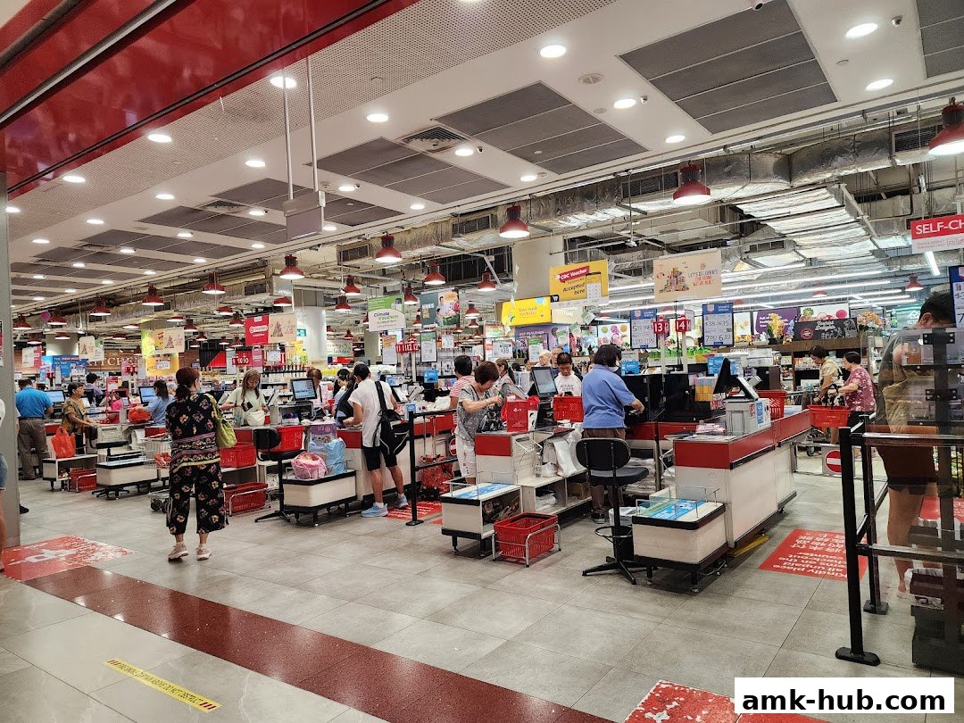Busy checkout area with customers and staff at FairPrice Xtra AMK Hub.