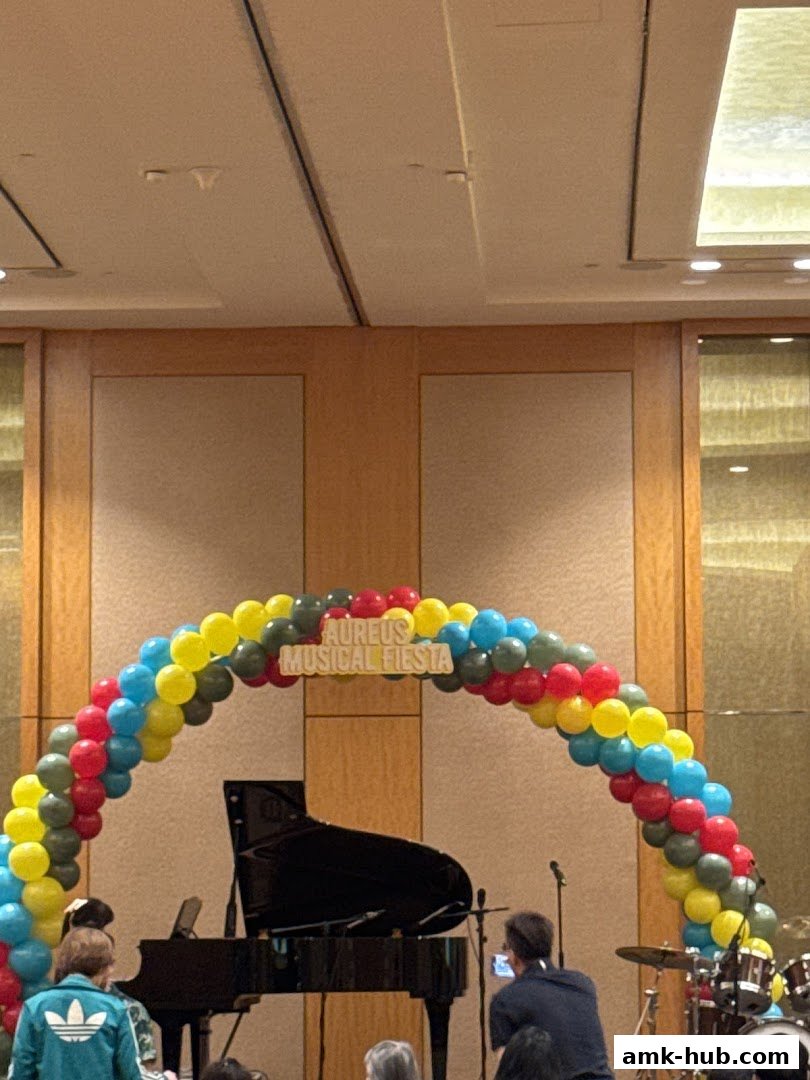 Aureus Musical Fiesta event with a grand piano and balloon arch.