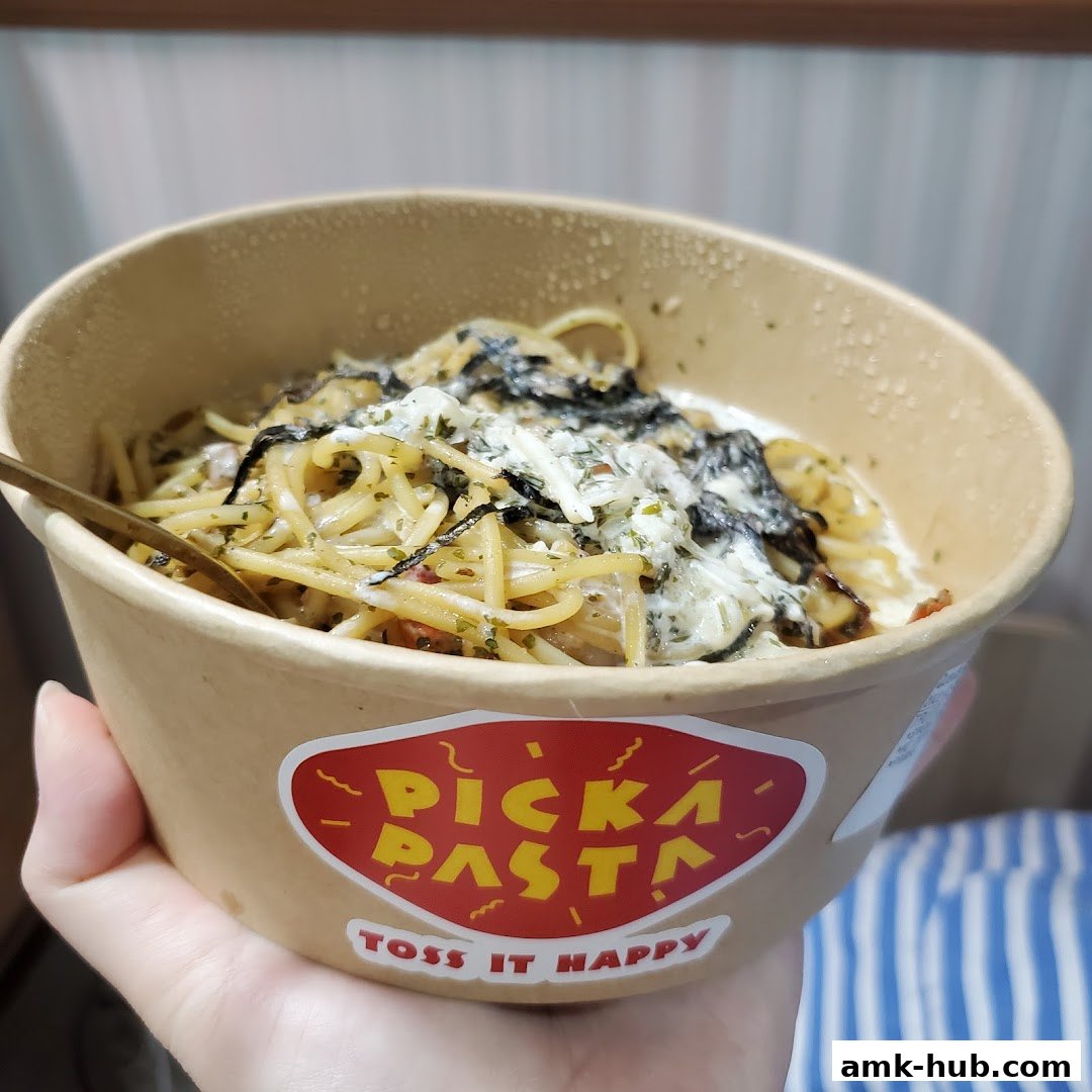 A close-up shot of a delicious pasta dish in a takeaway bowl from Big Pasta Small Pasta.