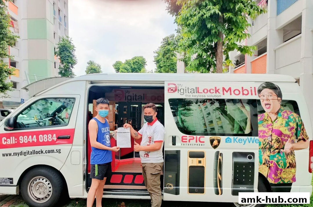 Two men stand next to a van promoting digital locks, with one handing a document to the other.