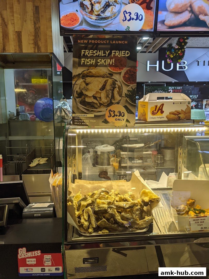 A shop display featuring freshly fried fish skin snacks in various flavors.