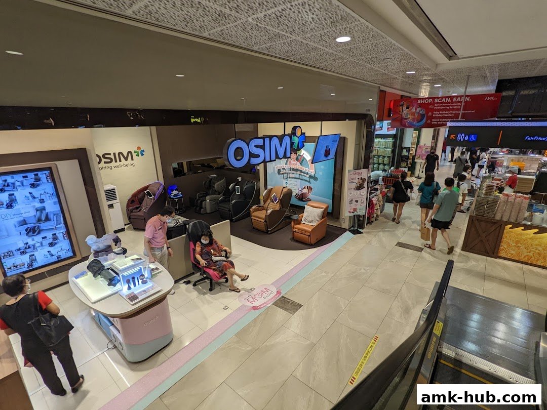 Interior view of an OSIM shop with massage chairs and promotional displays.