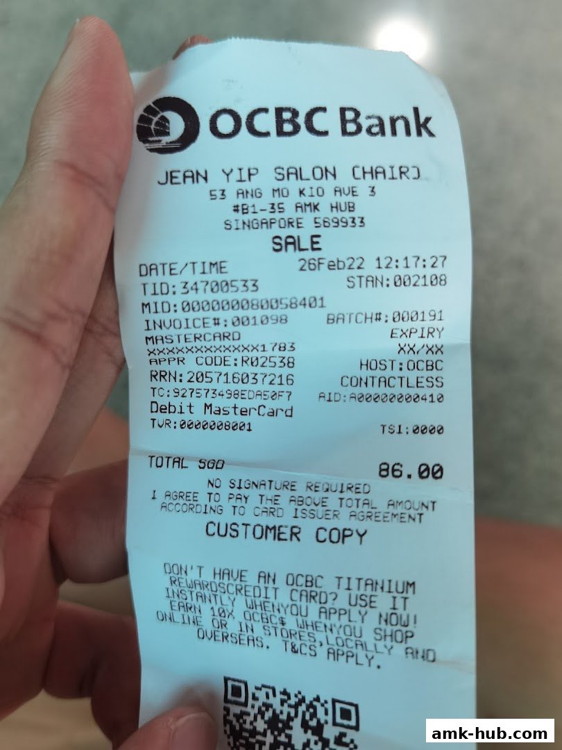 A receipt from Jean Yip Salon Chair at AMK Hub, showing a transaction with OCBC Bank.