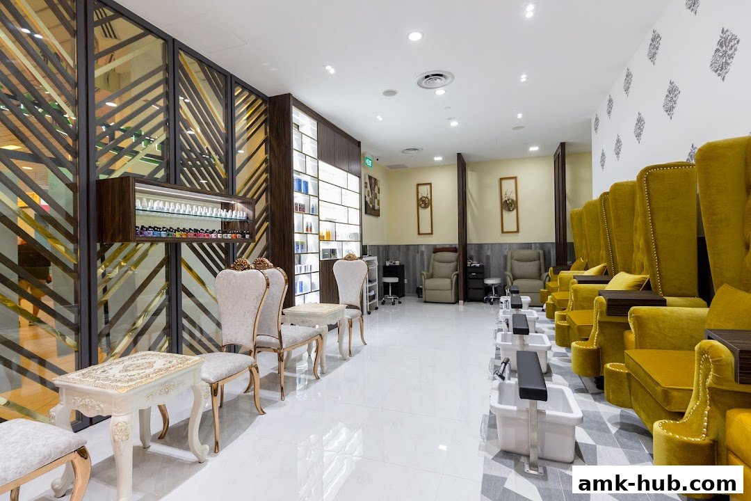 Interior of a luxurious spa with pedicure chairs, massage chairs, and product displays.