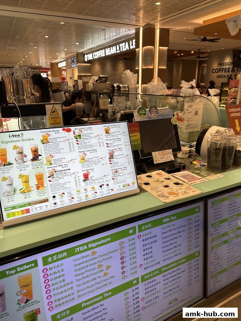 A digital menu board displaying various drinks and their prices at iTEA.