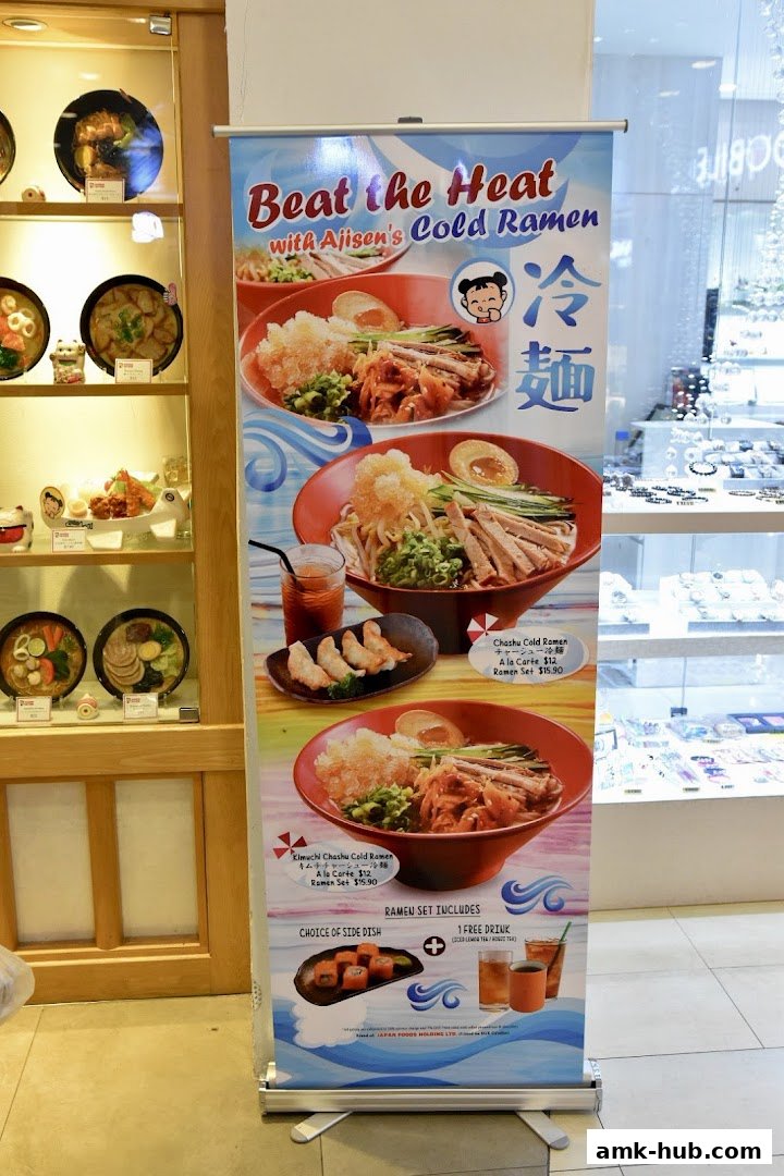A promotional banner for Ajisen's Cold Ramen, featuring different ramen bowls and side dishes.