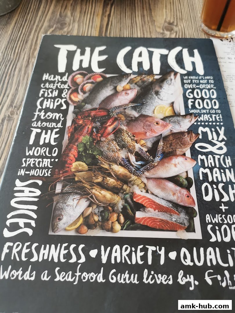 A menu from 'The Catch' showcasing a variety of fresh seafood and fish and chips.