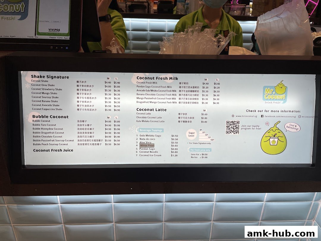 A menu board for Mr. Coconut, displaying various coconut shakes, lattes, and fresh juices.