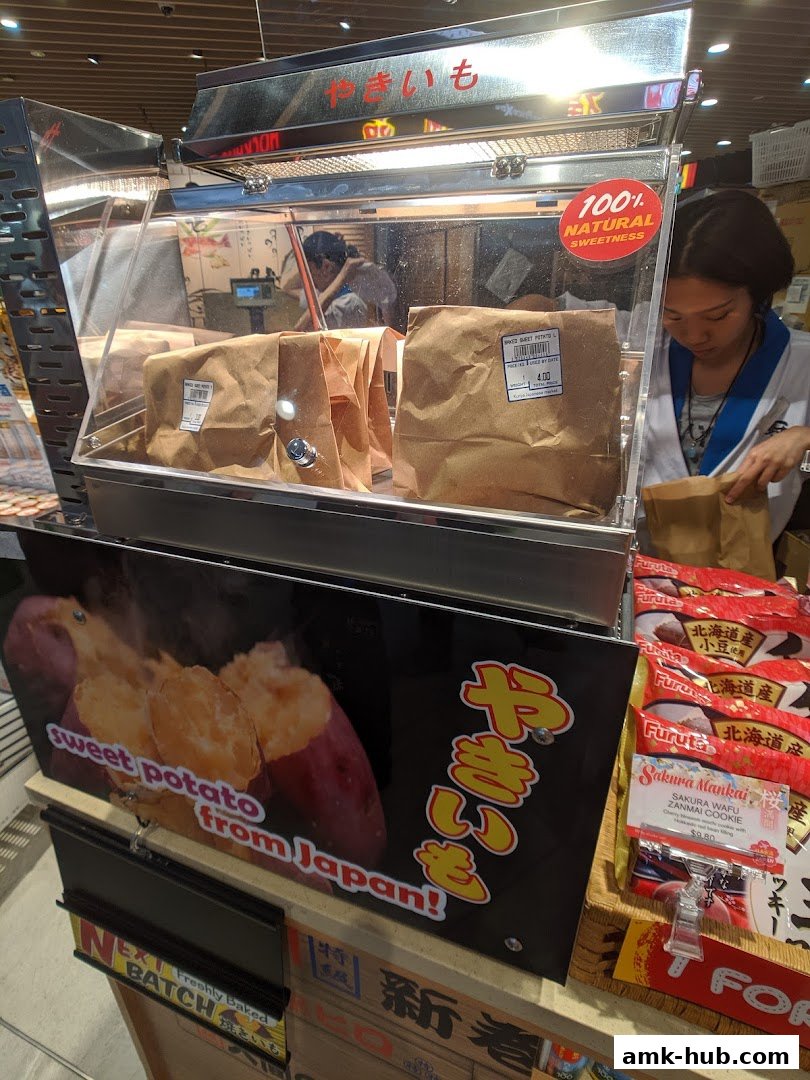 A display of freshly baked Japanese sweet potatoes and cookies at Kuriya Japanese Market.