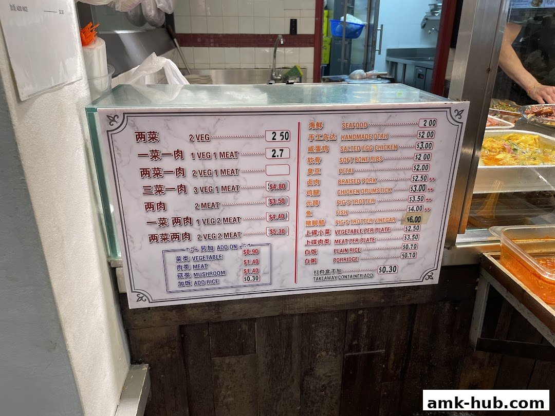 A menu board displaying various dishes and their prices at a Malaysian food stall.