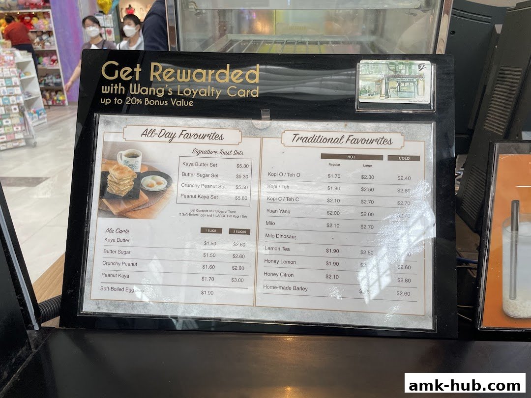 A menu board for Heavenly Wang featuring toast sets and traditional drinks.