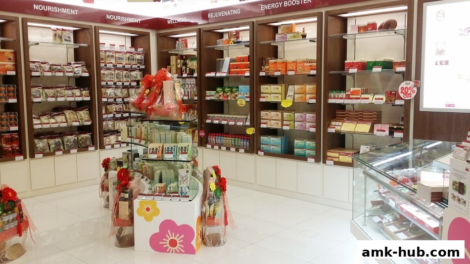 Interior view of a Eu Yan Sang shop showcasing shelves stocked with health products and gift baskets.