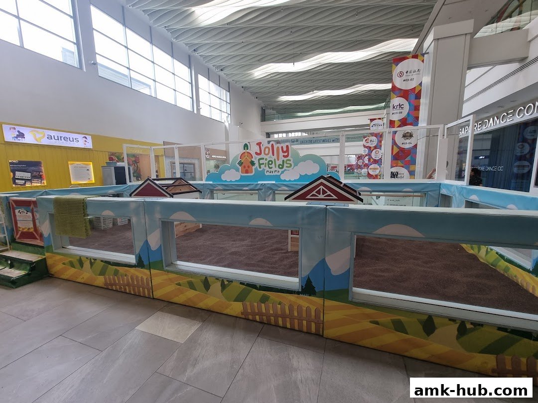 A colorful indoor play area for children with a farm theme.