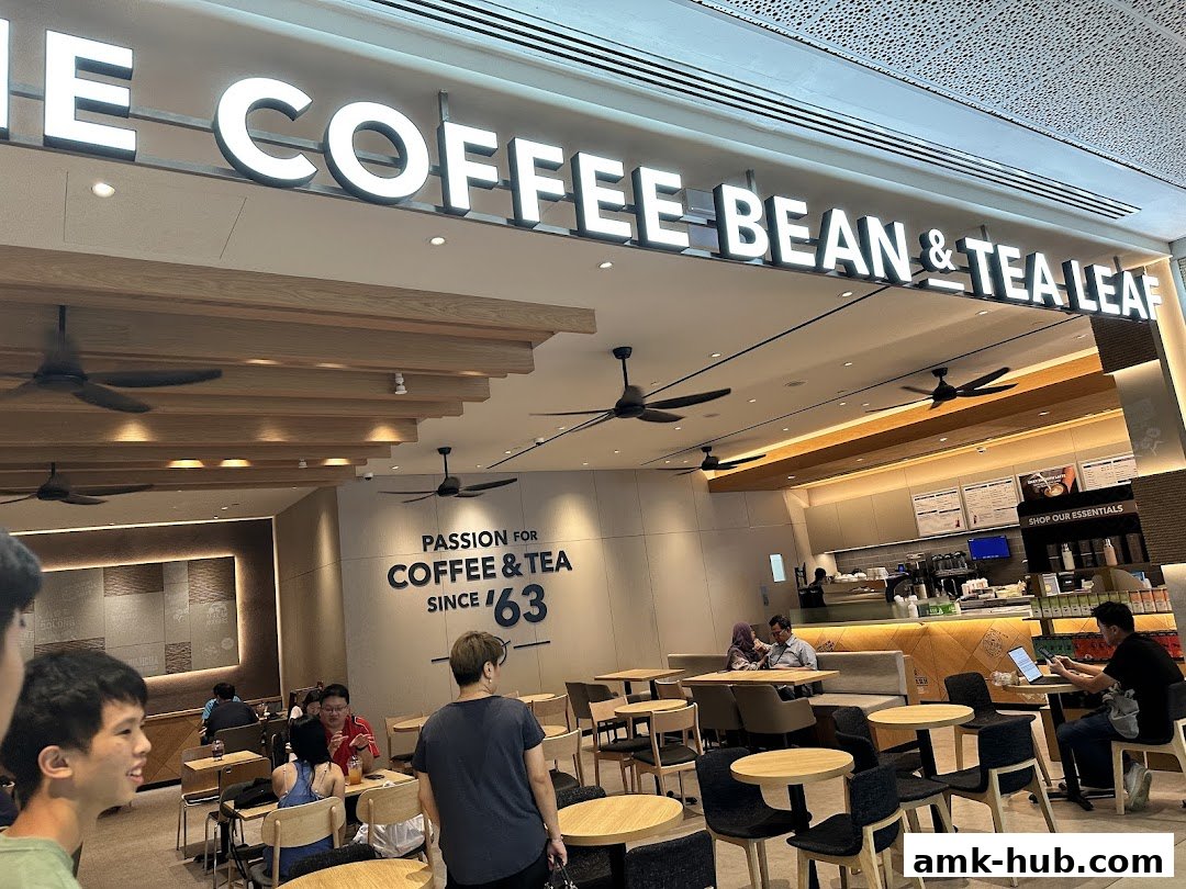 The Coffee Bean & Tea Leaf shop interior with customers seated at tables and a counter.