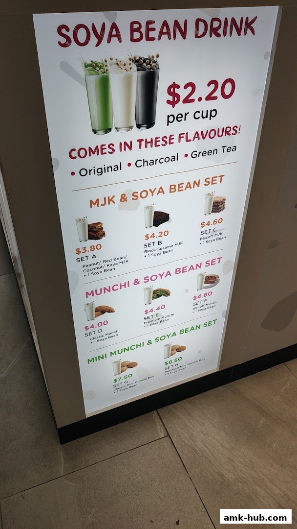 A menu board displaying various soya bean drinks and sets with prices.