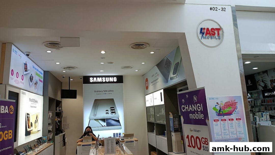 Interior view of Fast Mobile shop showcasing Samsung and Oppo phones, and mobile plans.