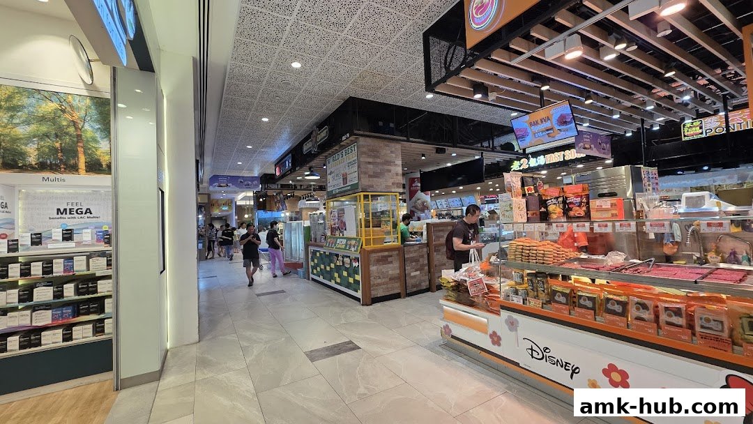 A retail shop selling bakkwa and other snacks, with a Disney-themed display.