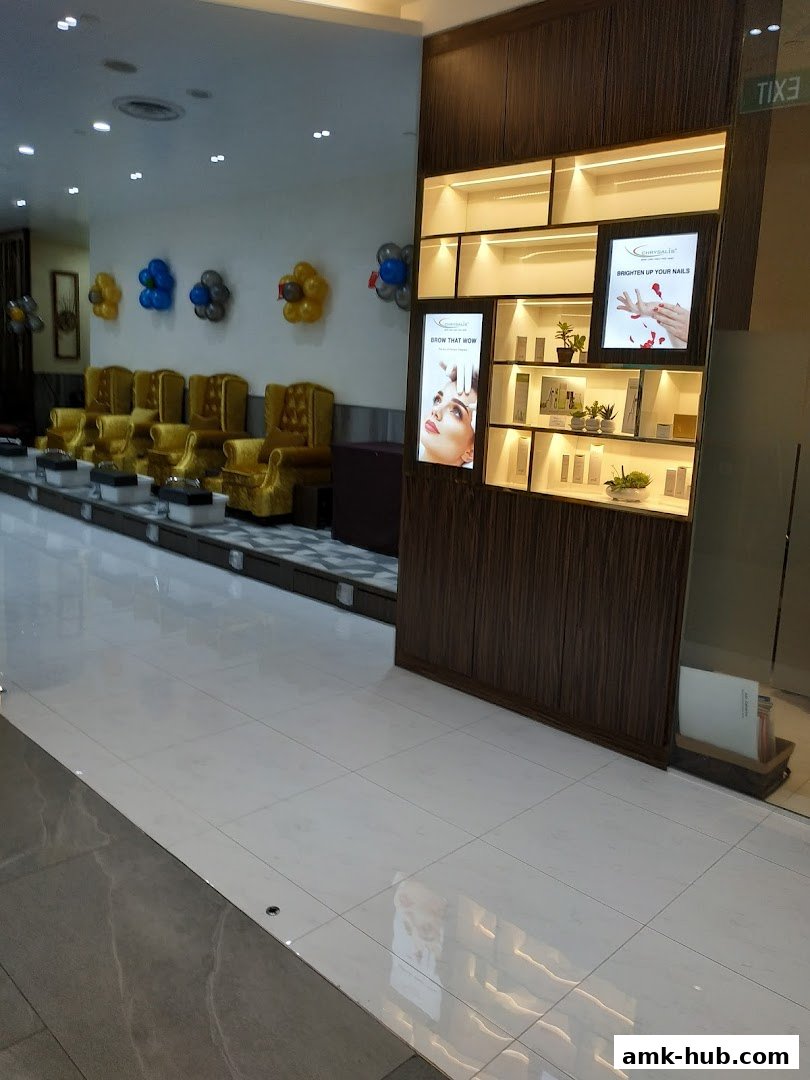 Interior of a spa with seating, product displays, and decorative balloons.