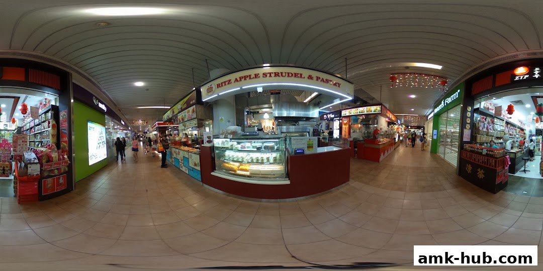 A view of the Ritz Apple Strudel & Pastry shop and surrounding mall corridor.
