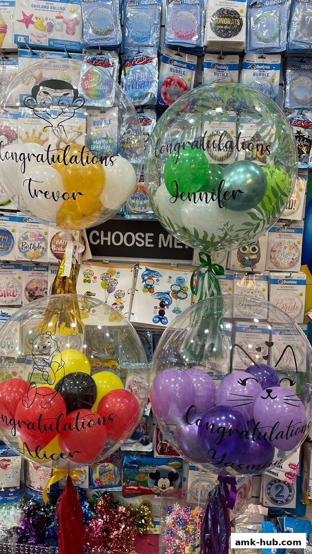 Customized bubble balloons with names and congratulatory messages displayed.