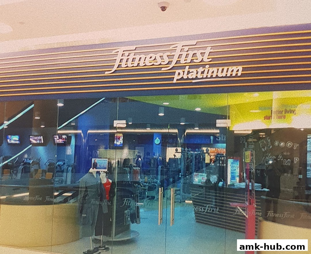 The entrance of Fitness First Platinum gym with exercise equipment visible inside.