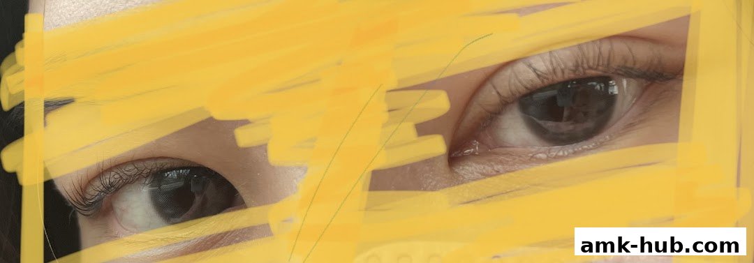 Close-up of a person's eyes with yellow scribbles covering parts of the face.