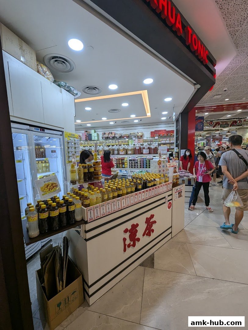 Hockhua Tonic shop front with various bottled tonics and herbal drinks displayed.