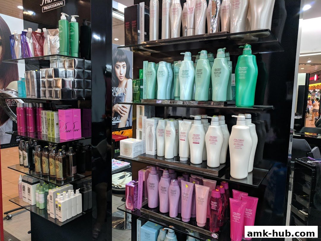 Shelves stocked with various hair care products, including shampoos, conditioners, and treatments.