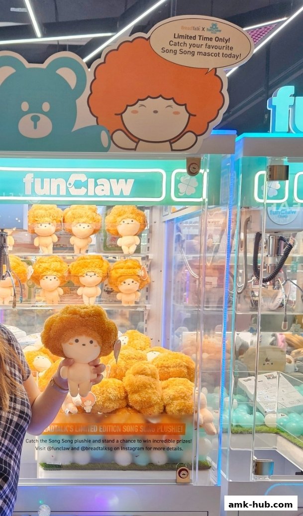 A person holds a plush toy in front of a claw machine filled with similar toys.