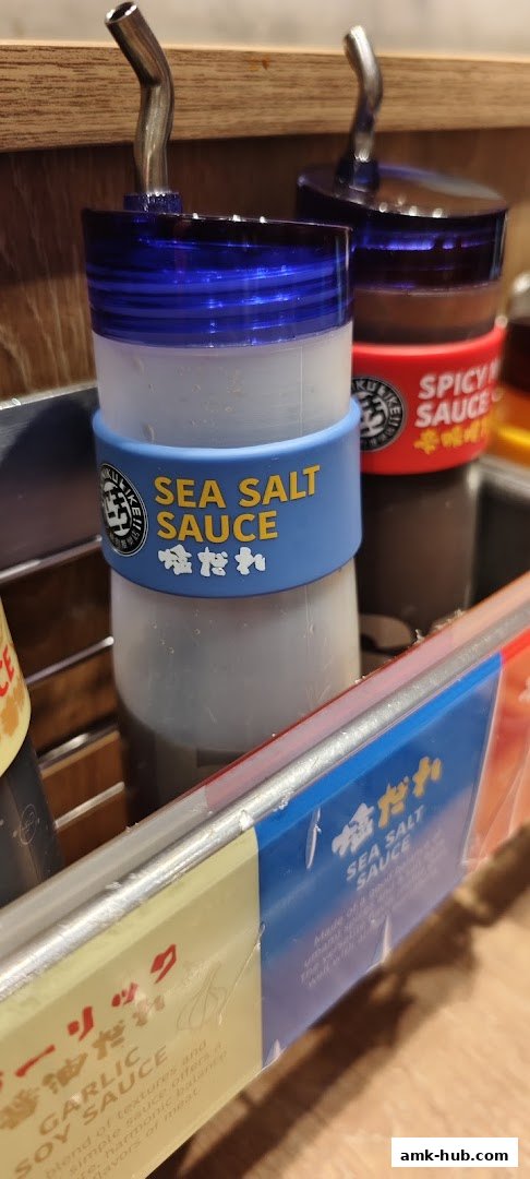 Bottles of Sea Salt Sauce and Spicy Sauce with Japanese text.