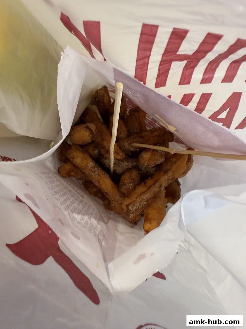 A bag of Shihlin Taiwan Street Snacks sweet potato fries with toothpicks.